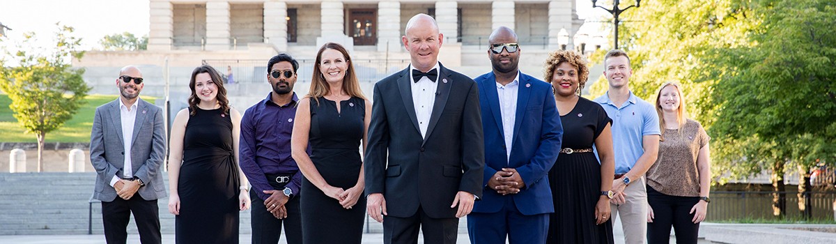 Comptroller staff dressed up outside Capitol building. 