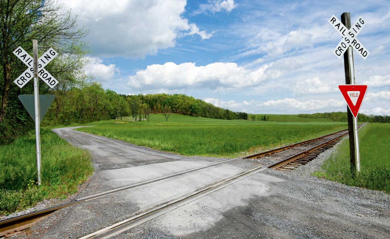railroad tracks crossing a road