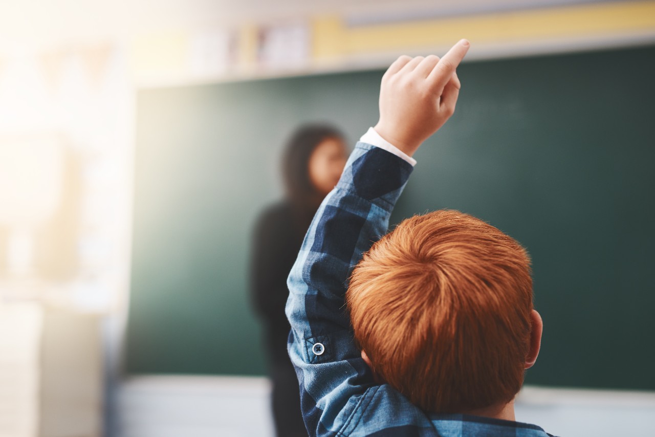 1136971353 Cropped shot of elementary school children raising their hands to ask questions in the class
